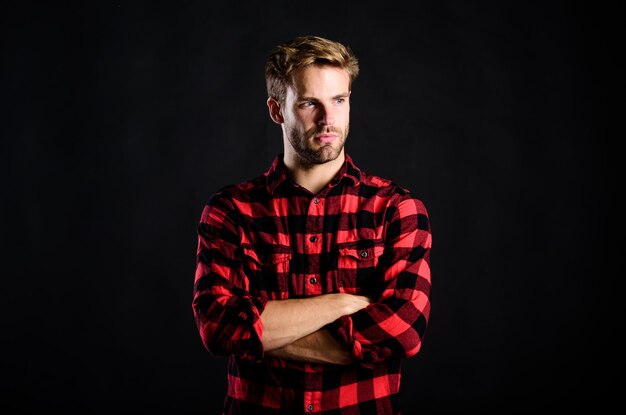 Pure confidence western cowboy portrait retro male fashion Vintage style man man checkered shirt western man black background handsome man with beard after barbershop charisma