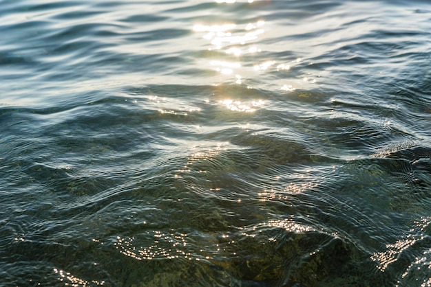 Pure sea waves in the sun at sunset