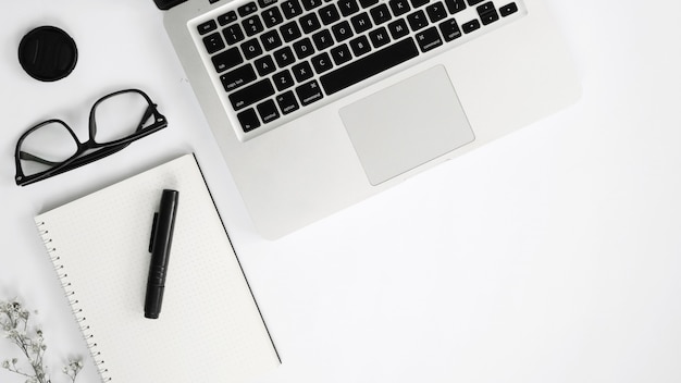 Pure white background view with mouse keyboard and glasses