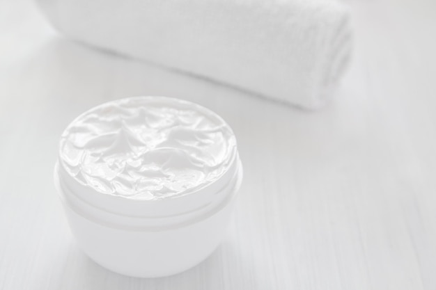 Pure white moisturizer in a white jar