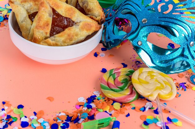 Purim with carnival mask, party costume and hamantasc