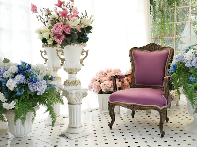 Purple armchair in room full of flower