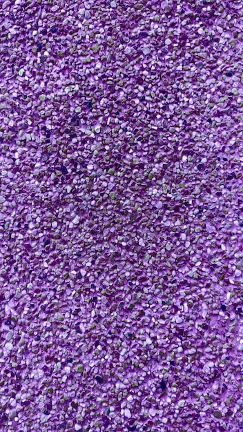 Purple background of a pile of small purple beads.