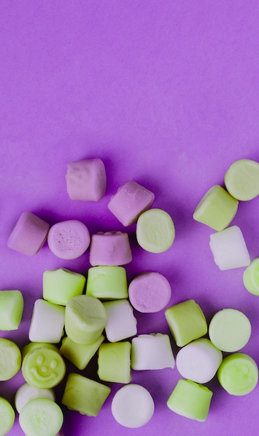 A purple background with marshmallows on it