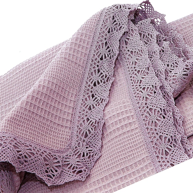 A purple blanket with laces and a pink blanket.