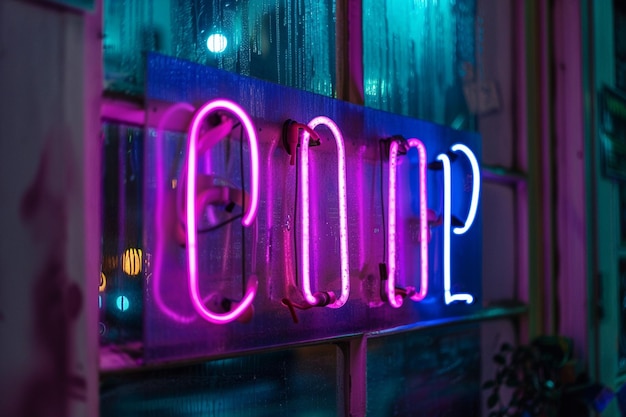 Photo a purple and blue neon sign that says the word on it