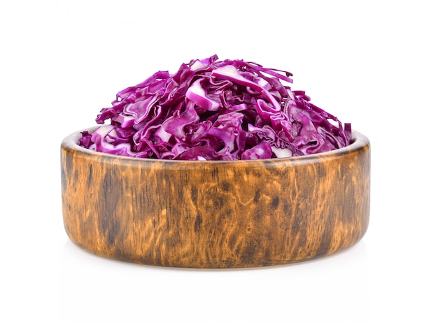 Purple cabbage leaves isolated in wood bowl