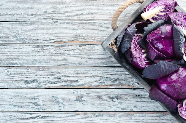 Purple cabbage in a wooden box Organic food Top view Free space for your text