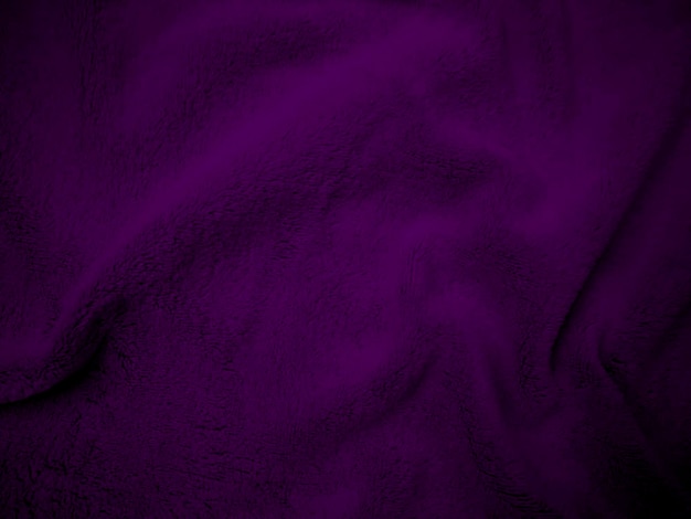 紫色のきれいなウール生地テクスチャ背景光天然羊毛デザイナーのクローズ アップ フラグメント ウール カーペットのためのふわふわの毛皮の紫のシームレスな綿のテクスチャ