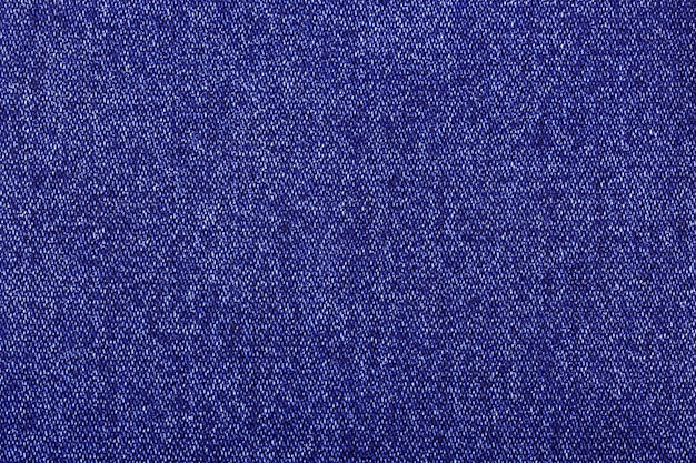 purple color jeans texture factory fabric on white background close up