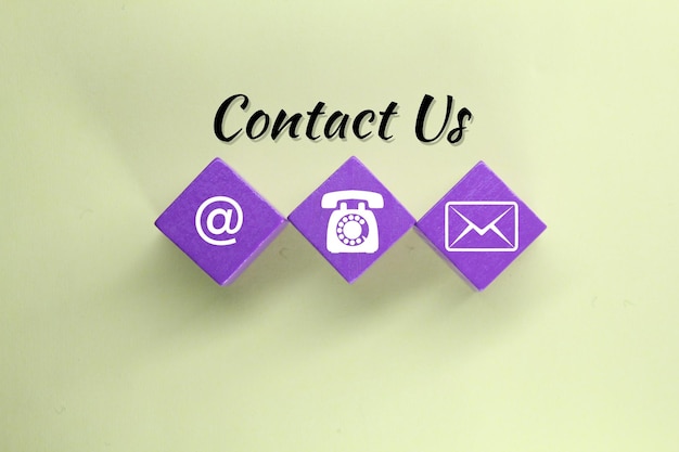 Purple cubes with the word contact us on them