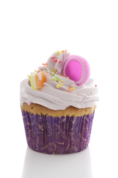 Purple cupcake isolated in white