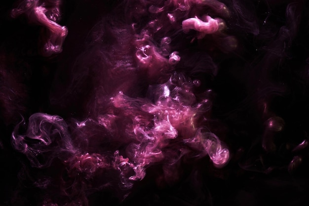 Purple dark abstract background luxury colored smoke acrylic paint underwater explosion cosmic swirling ink