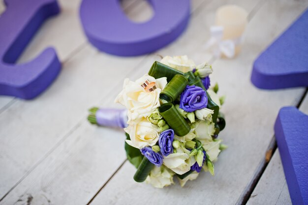 Purple decor wedding word love with bouquet and rings