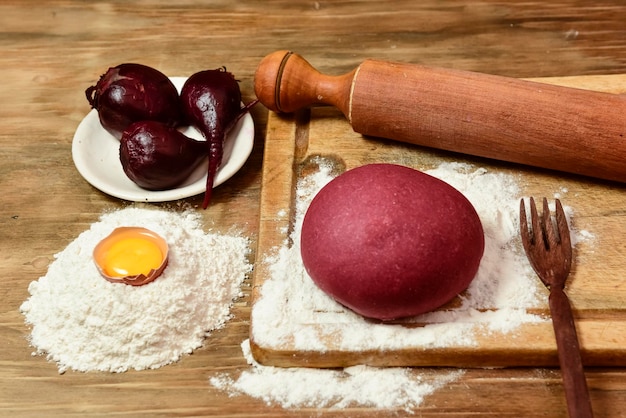 Purple dough bun for noodles with ingredients on the table