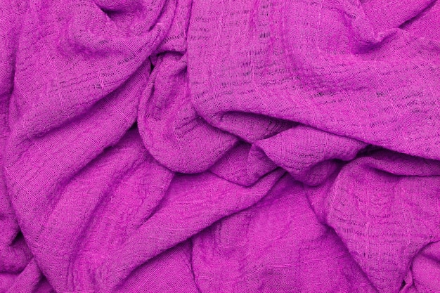 A purple fabric texture in a close up view