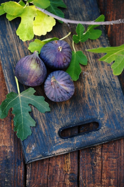 Purple figs on a wooden board