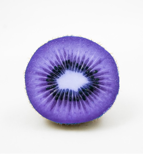 A purple fruit with a cross in the middle