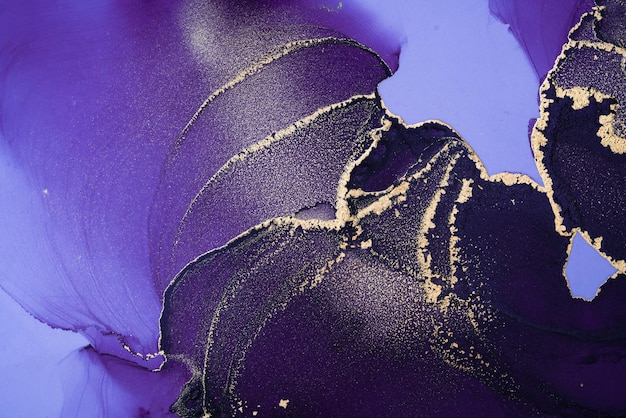 A purple and gold paint is shown on a purple background.