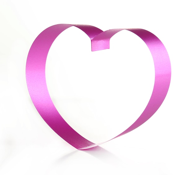 Purple heart from ribbon isolated on white