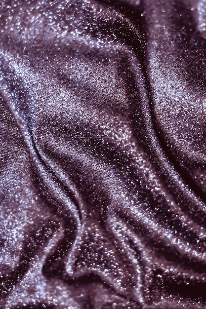 Purple holiday sparkling glitter abstract background luxury shiny fabric material for glamour design and festive invitation