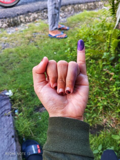 Photo purple ink on finger after presidential election
