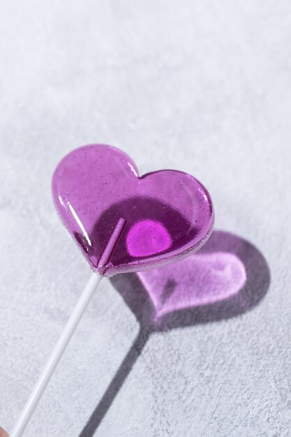 Purple lollipop in the shape of a heart