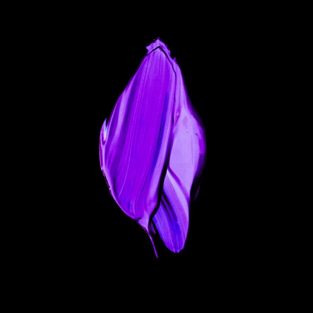 Purple neon paint brush stroke texture isolated on black background