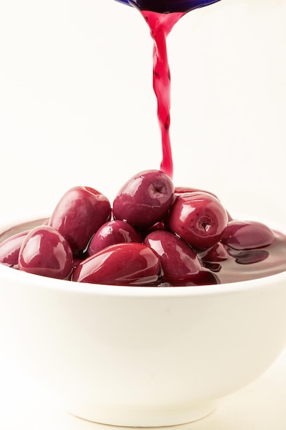 Purple olives in a bowl Selective focus