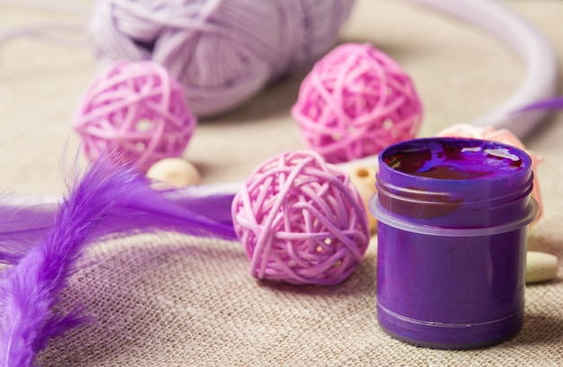 Photo purple paint, wooden beads, feathers