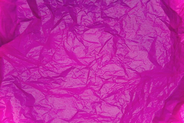 Photo purple paper tissue background texture. wrinkled tissue paper texture, close up.