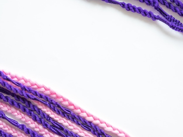 Purple and pink kanekolon afro braids space for text