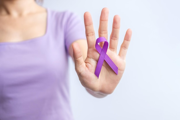 Purple Ribbon for Violence Pancreatic Esophageal Testicular cancer Alzheimer epilepsy lupus Sarcoidosis and Fibromyalgia Awareness month and World cancer day concept