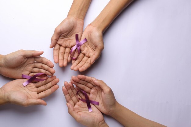 Purple ribbons for cancer awareness World Cancer Day background