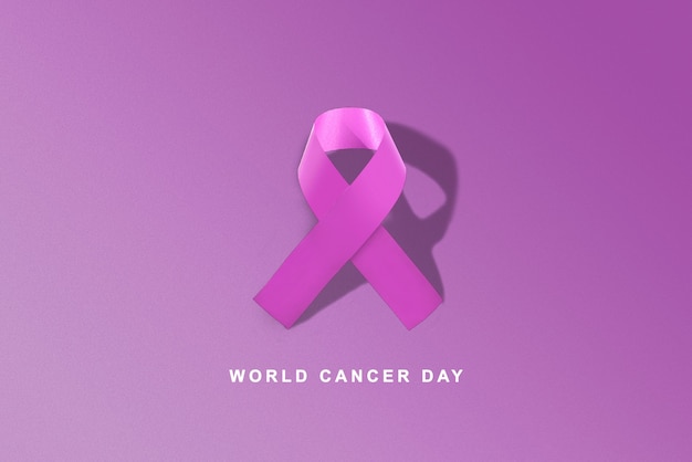 Purple ribbons on a colored background. World Cancer Day concept