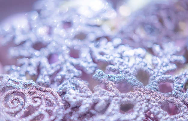 Purple shiny snowflakes closeup Gentle winter holiday background