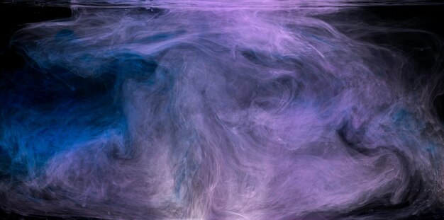 Photo purple smoke on a black background photo