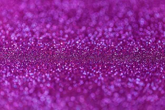 Purple sparkling background from small sequins