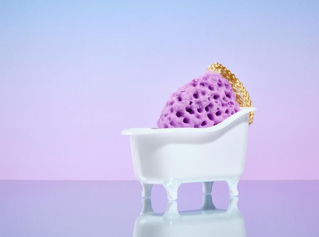 Purple sponge for water and grooming treatments in a bathtub shaped stand Copy space for text