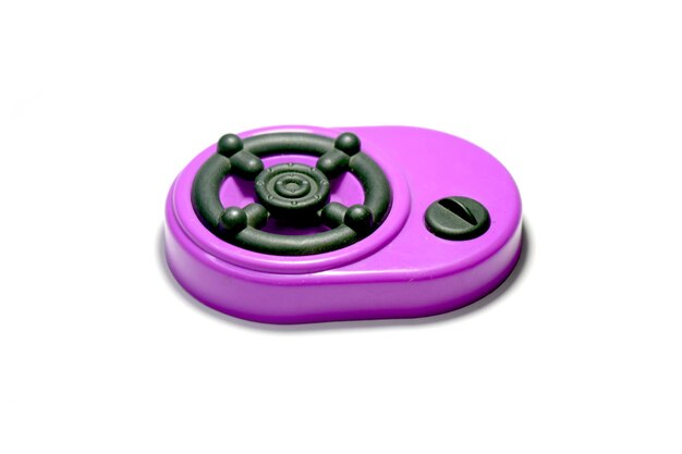 Photo a purple stove toy with a black button child's toys