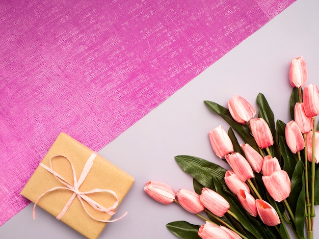 Purple tulip and gift box on Purple background 