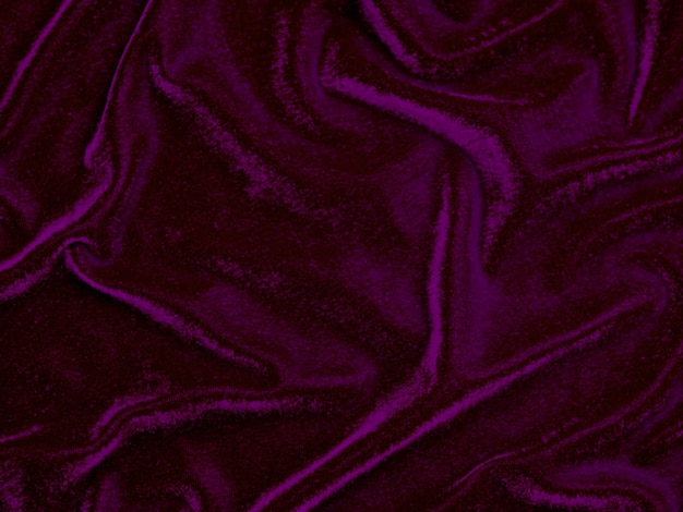 Текстура фиолетовой бархатной ткани, используемая в качестве фона. Пустой фиолетовый фон ткани из мягкого и гладкого текстильного материала. Есть место для textxA