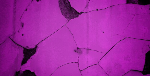 A purple wall with a cracked surface and a crack in it.