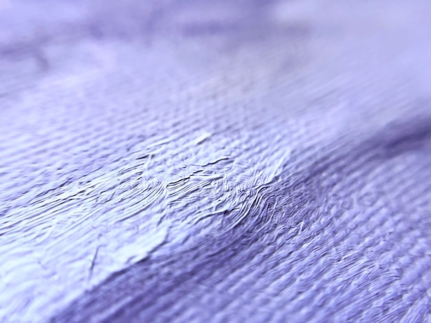 purple and white brush strokes on a canvas closeup