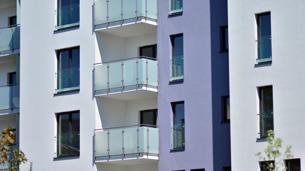 a purple and white building with balconies and balconies.