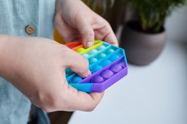 Push pop bubble sensory fidget toy octagon shape in hands