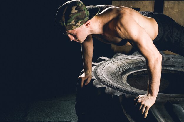 Push up exercise on tire fitness training