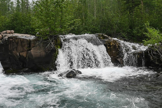 Putorana Plateau a waterfall on the Grayling Stream