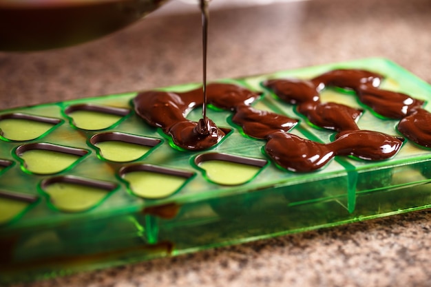 Putting chocolate in mold