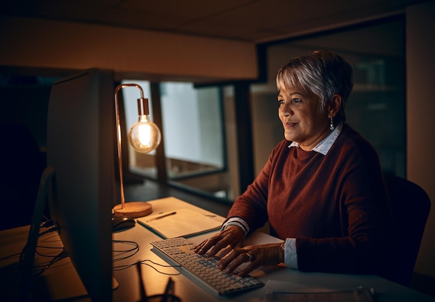 Putting in those overtime hours Shot of a mature businesswoman working late in an office